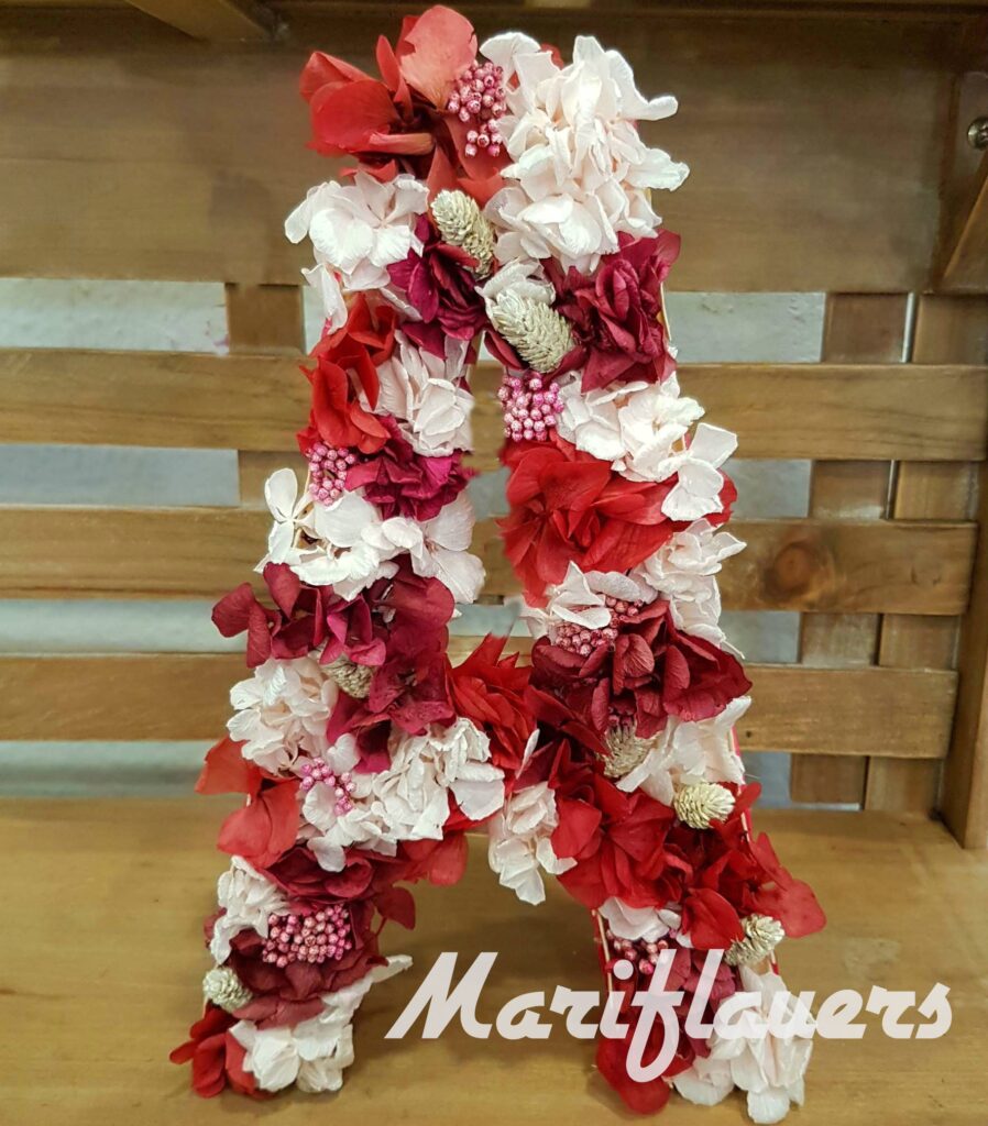 Letra de flores preservadas